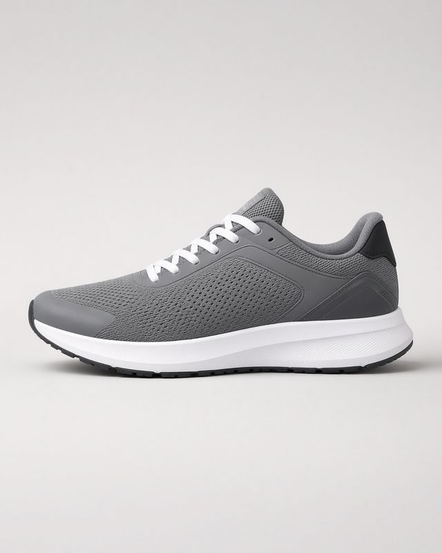 A grey running shoe in side view