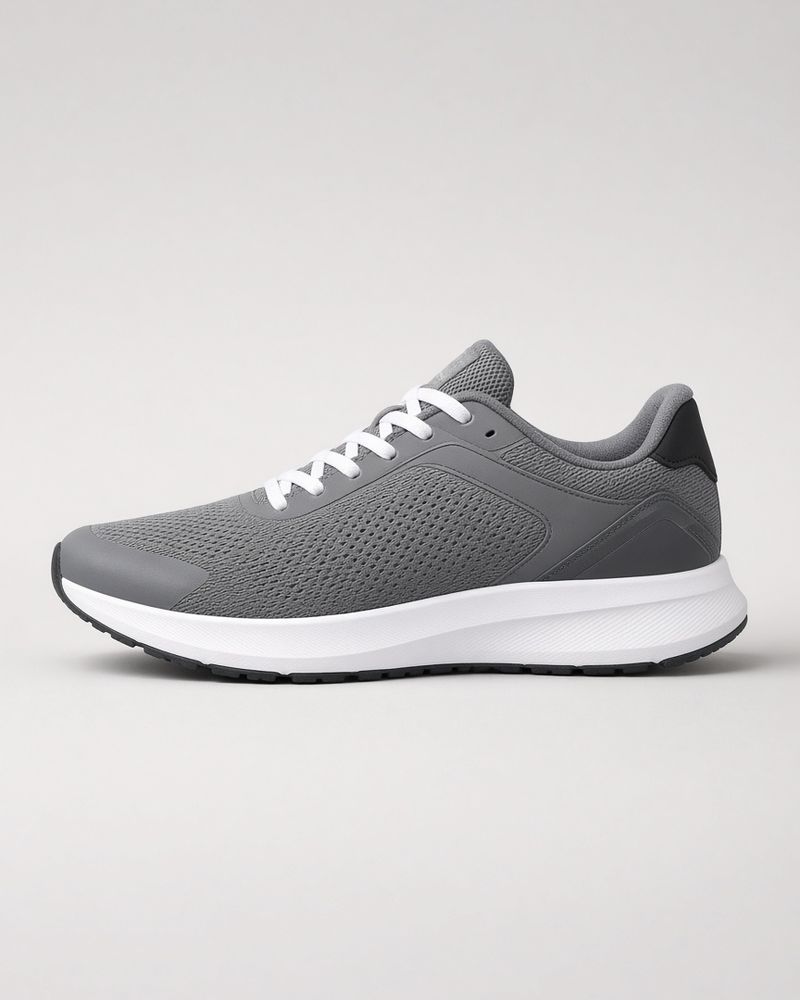 A grey running shoe in side view